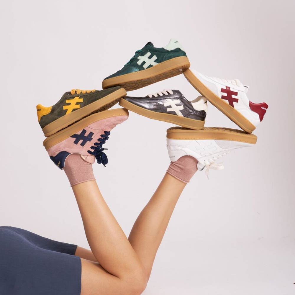 a pile of shoes by brand another trend