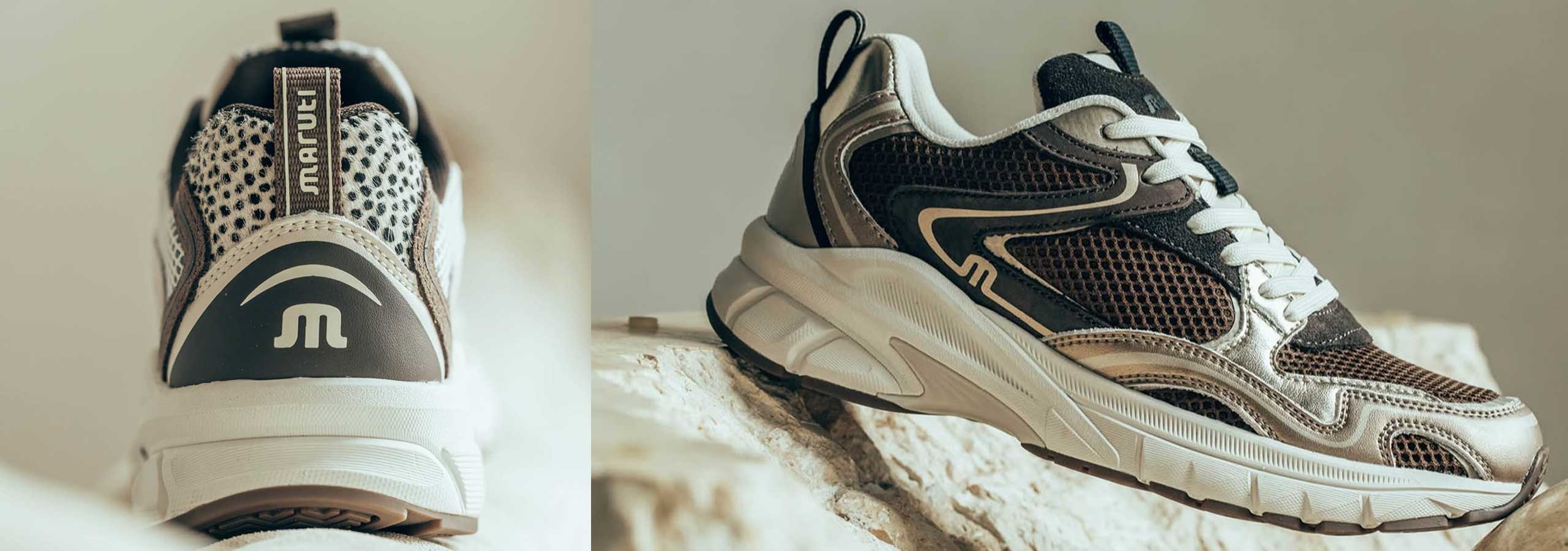 Pair of running shoes with a brand logo on a neutral background